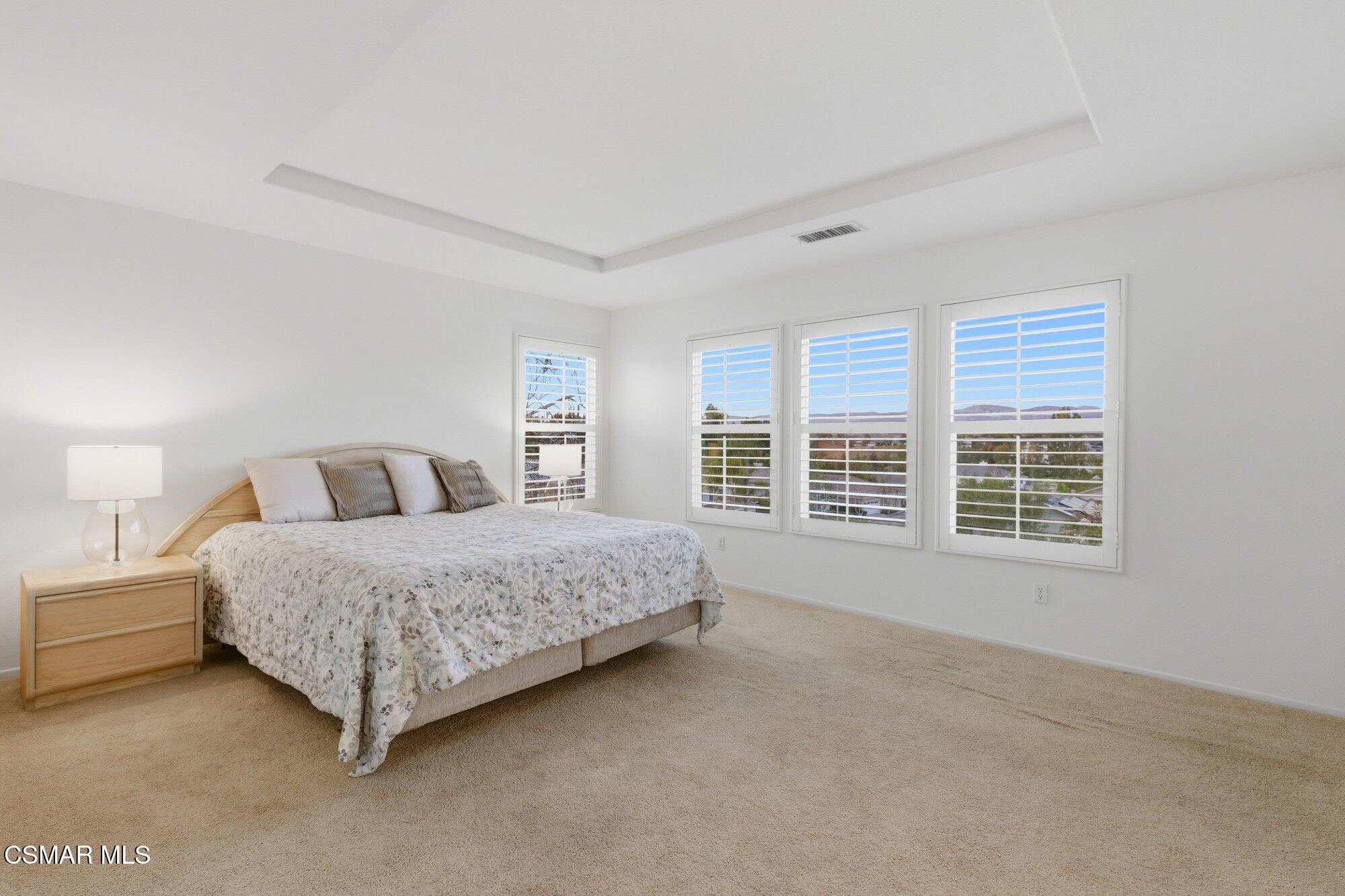 3205 Pine View Drive Simi Valley, CA 93065 - Photo 32 of 72 a spacious bedroom with a large bed and a large window