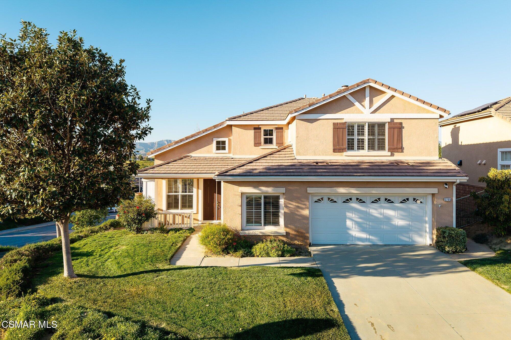 3205 Pine View Drive Simi Valley, CA 93065 - Photo 64 of 72 a front view of a house with a yard
