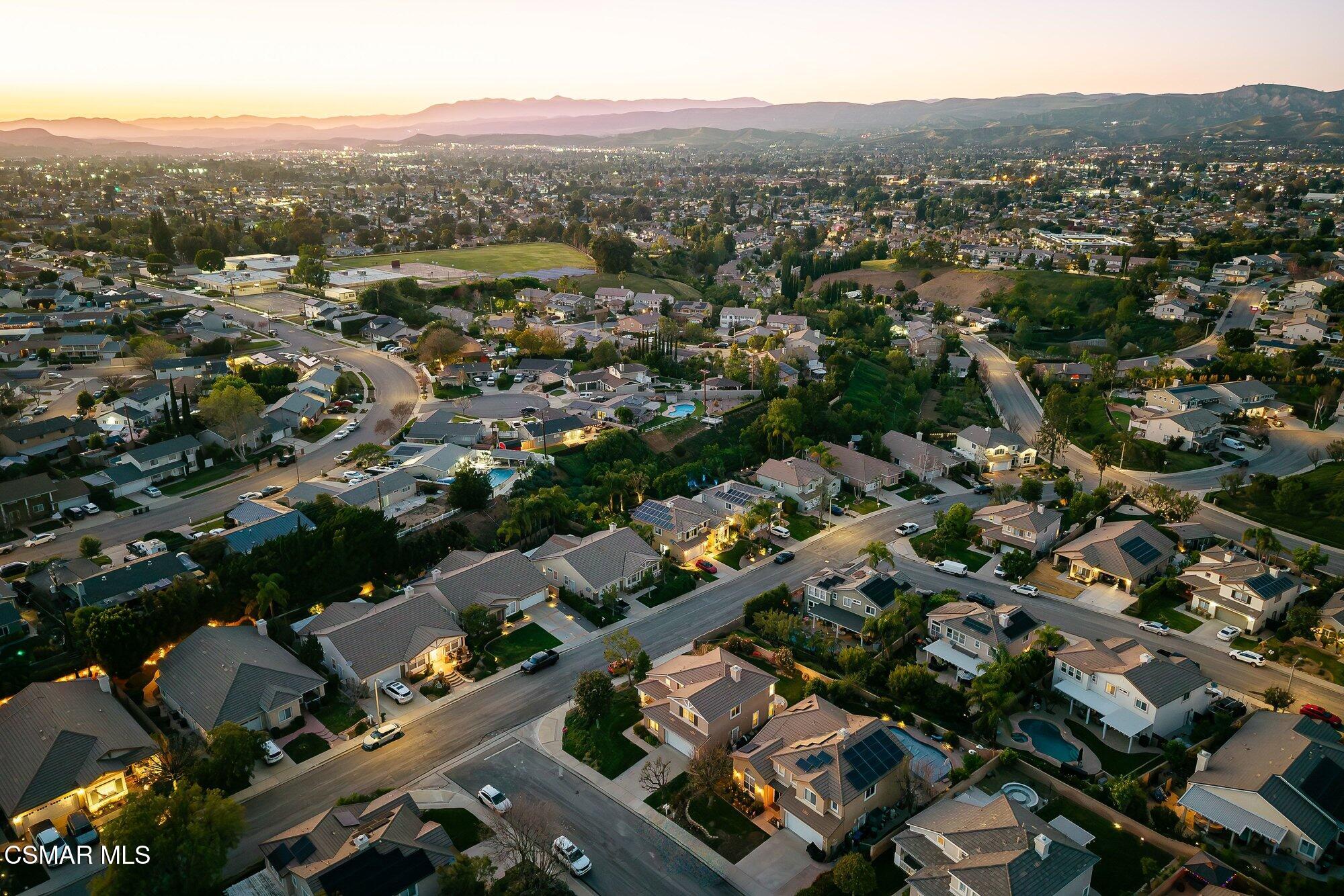 3205 Pine View Drive Simi Valley, CA 93065 - Photo 67 of 72 an aerial view of city with lots of residential buildings and mountain view in back
