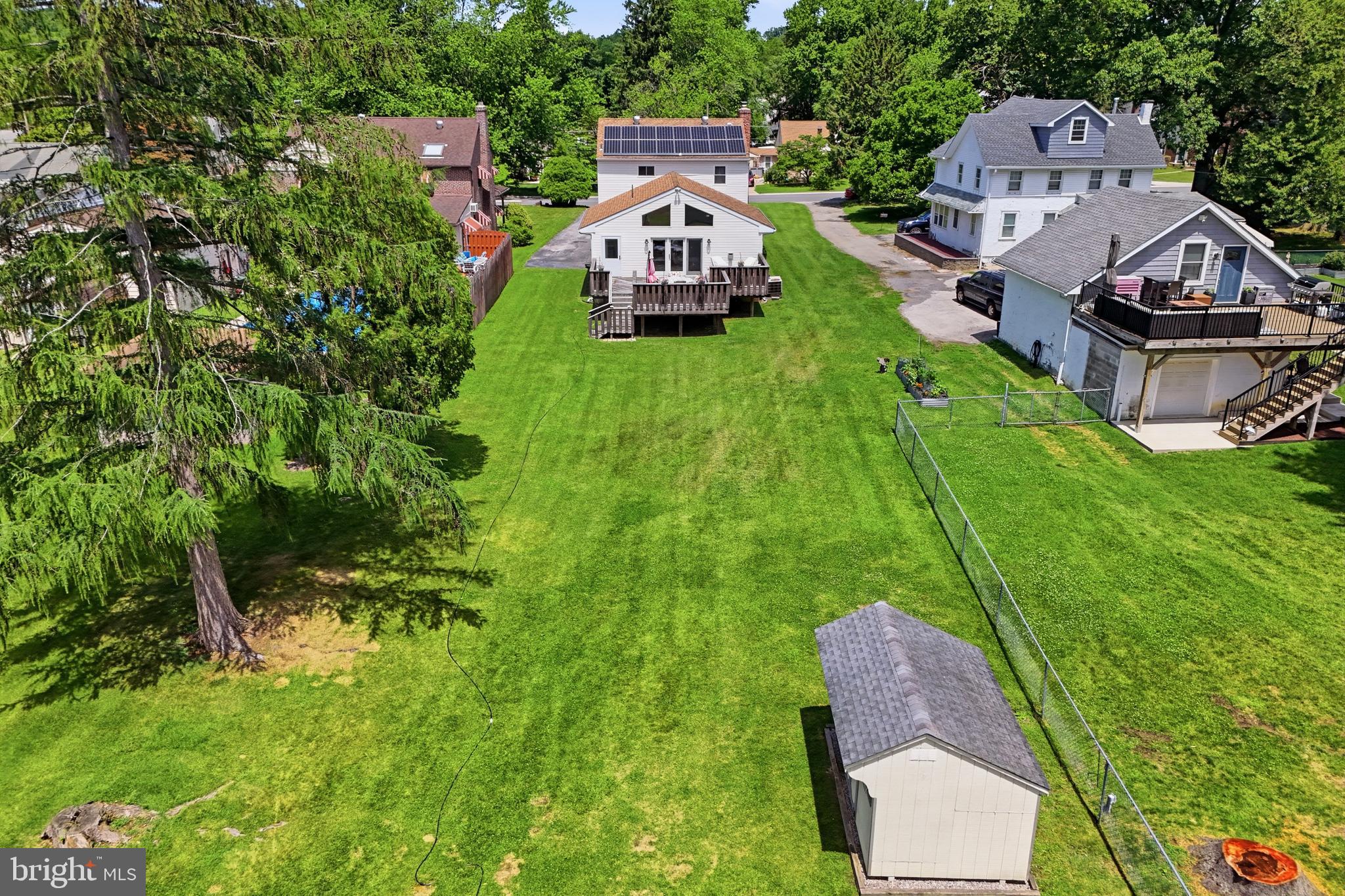 1004 Green Lane Secane, PA 19018 - Photo 42 of 49 an aerial view of a house with garden space and a car park in back