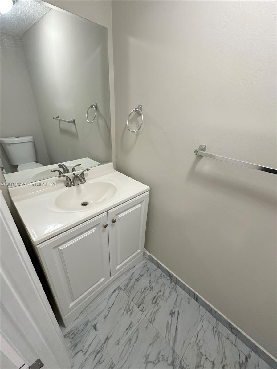 3051 West 76th Street, Unit D211 Hialeah, FL 33018 - Photo 13 of 22 a utility room with sink dryer and washer