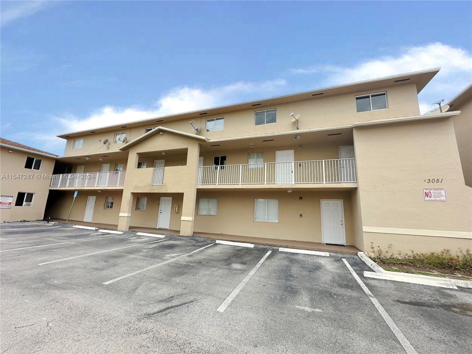 3051 West 76th Street, Unit D211 Hialeah, FL 33018 - Photo 3 of 22 a view of a building