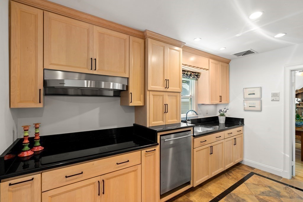 6 Dean Road Marblehead, MA 01945 - Photo 11 of 29 a kitchen with granite countertop white cabinets and white appliances