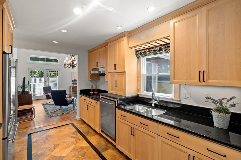 6 Dean Road Marblehead, MA 01945 - Photo 13 of 29 a kitchen with stainless steel appliances a sink stove and cabinets