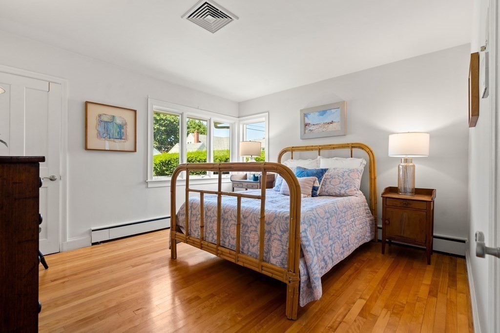 6 Dean Road Marblehead, MA 01945 - Photo 17 of 29 a bedroom with two beds and wooden floor