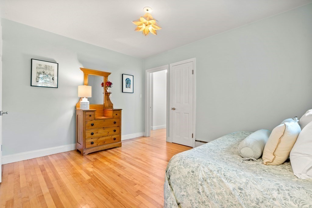 6 Dean Road Marblehead, MA 01945 - Photo 22 of 29 a bedroom with a bed and wooden floor