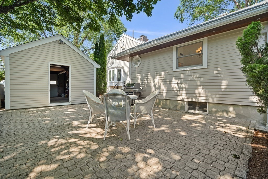 6 Dean Road Marblehead, MA 01945 - Photo 27 of 29 a view of a chairs and table in backyard of the house