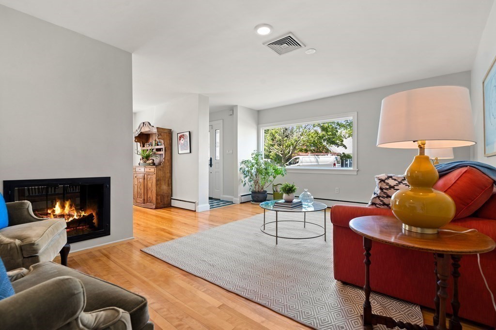 6 Dean Road Marblehead, MA 01945 - Photo 7 of 29 a living room with furniture and a fireplace