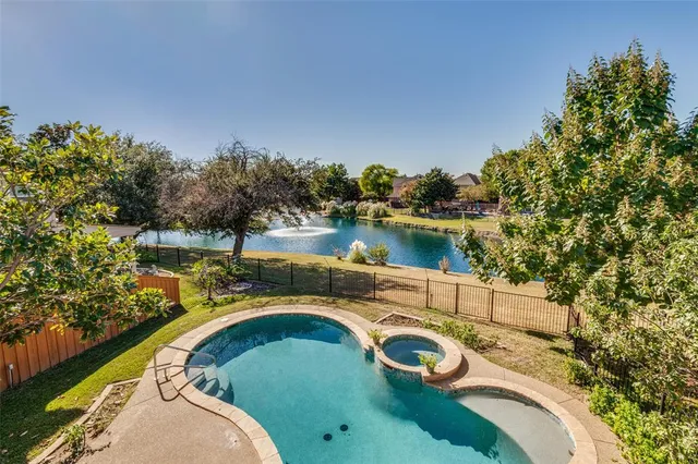 a view of a swimming pool with a lake view