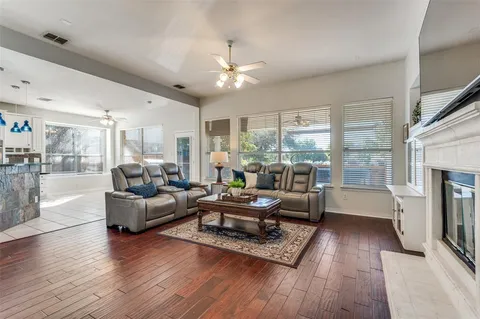 a living room with furniture and a fireplace
