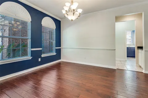a view of a livingroom with wooden floor