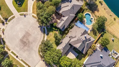 an aerial view of a house with swimming pool