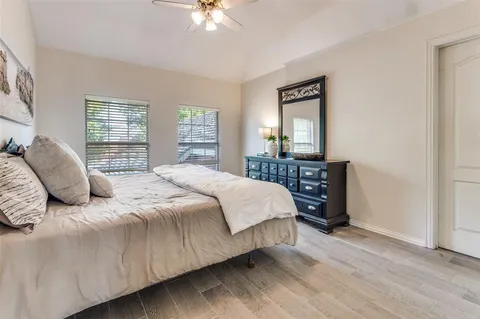 a bedroom with a bed and a table in it