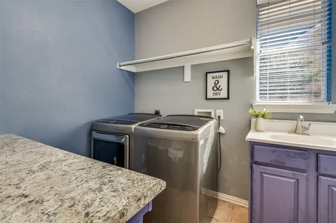 a kitchen with a stove and a sink