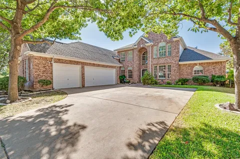 a front view of a house with yard