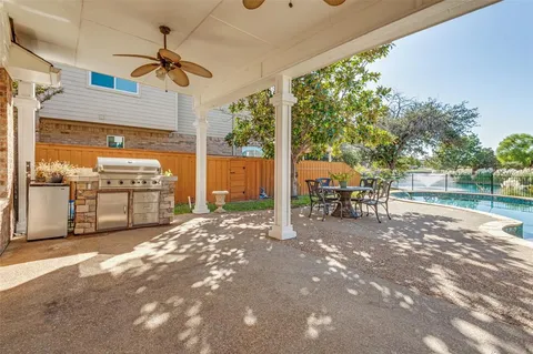 a view of a backyard with sitting area