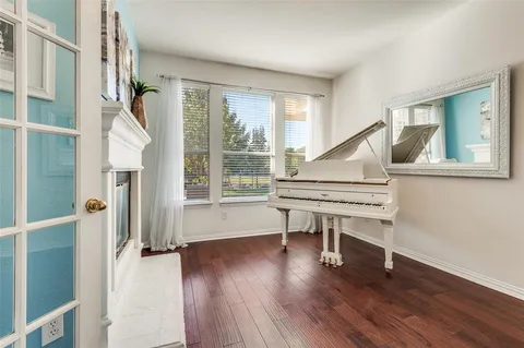 a view of entryway with wooden floor and windows