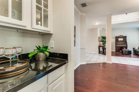 a kitchen with stainless steel appliances granite countertop a sink a stove and cabinets