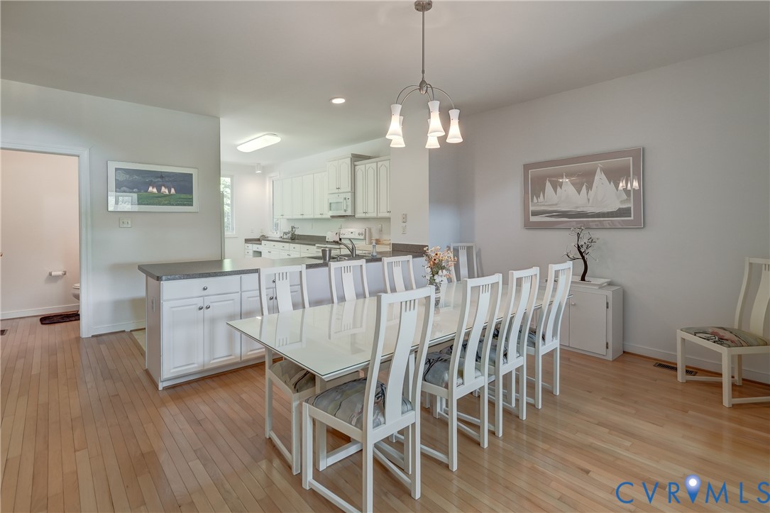 7902 Johnson Road Petersburg, VA 23805 - Photo 24 of 55 Open-concept dining area featuring light wood-fini