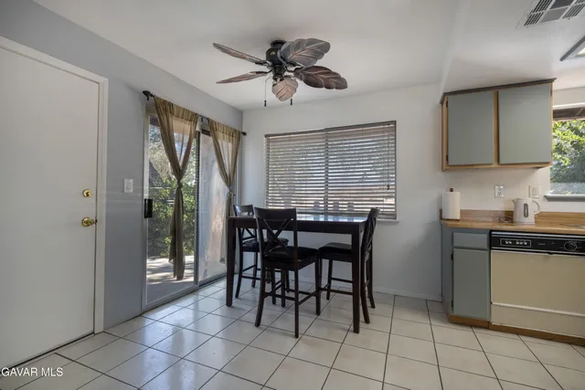 a dining room with furniture and window