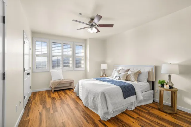 a bedroom with a bed and a chandelier