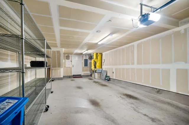 a view of empty room with white walls