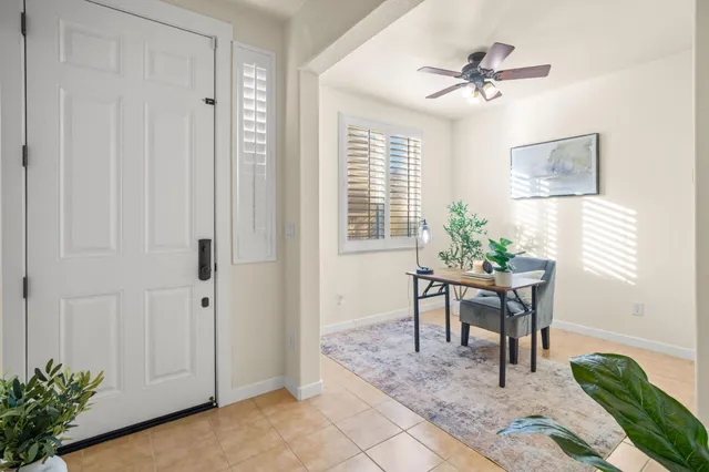 a dining room with furniture and window