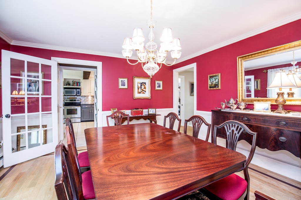 127 Haverhill Road Topsfield, MA 01983 - Photo 13 of 28 a view of a dining room with furniture and chandelier