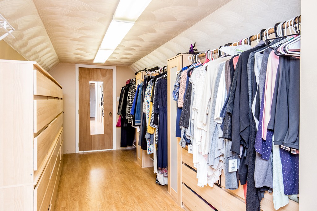 127 Haverhill Road Topsfield, MA 01983 - Photo 18 of 28 a view of walk in closet with clothes
