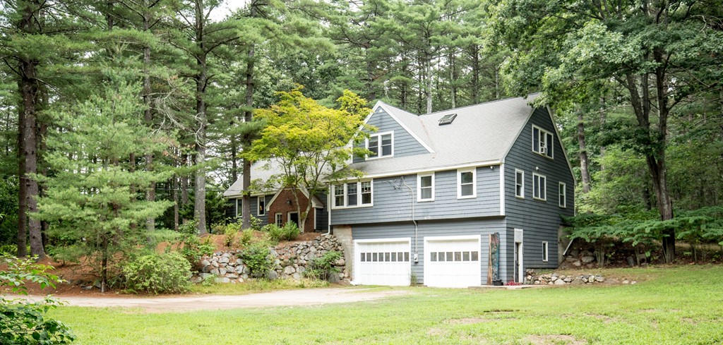 127 Haverhill Road Topsfield, MA 01983 - Photo 2 of 28 front view of a house with a yard