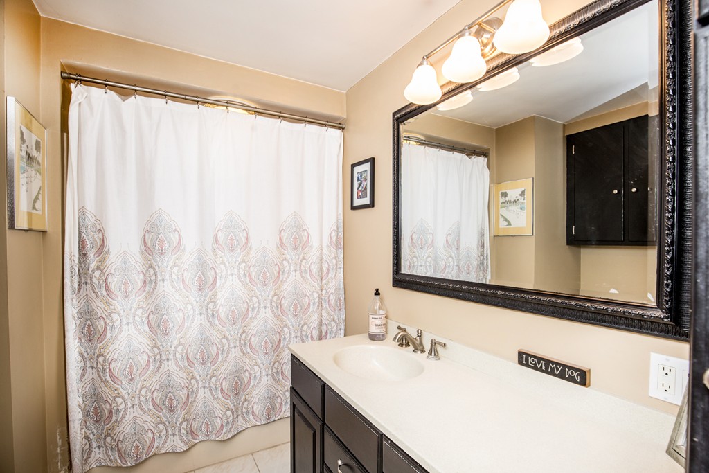 127 Haverhill Road Topsfield, MA 01983 - Photo 24 of 28 a bathroom with a sink and a mirror