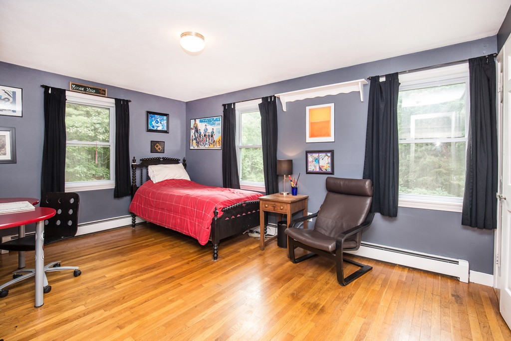 127 Haverhill Road Topsfield, MA 01983 - Photo 25 of 28 a bedroom with a bed chair and a large window