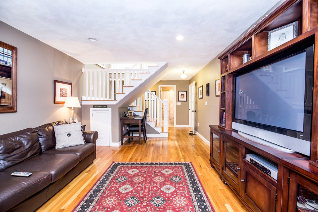 127 Haverhill Road Topsfield, MA 01983 - Photo 7 of 28 a living room with furniture flat screen tv and a table
