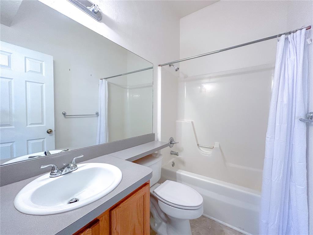 3575 Southwest 30th Way, Unit 119 Gainesville, FL 32608 - Photo 9 of 11 a bathroom with a sink and a mirror