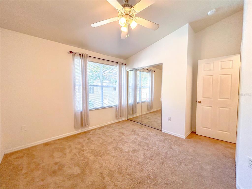 3575 Southwest 30th Way, Unit 119 Gainesville, FL 32608 - Photo 10 of 11 a view of an empty room with a window