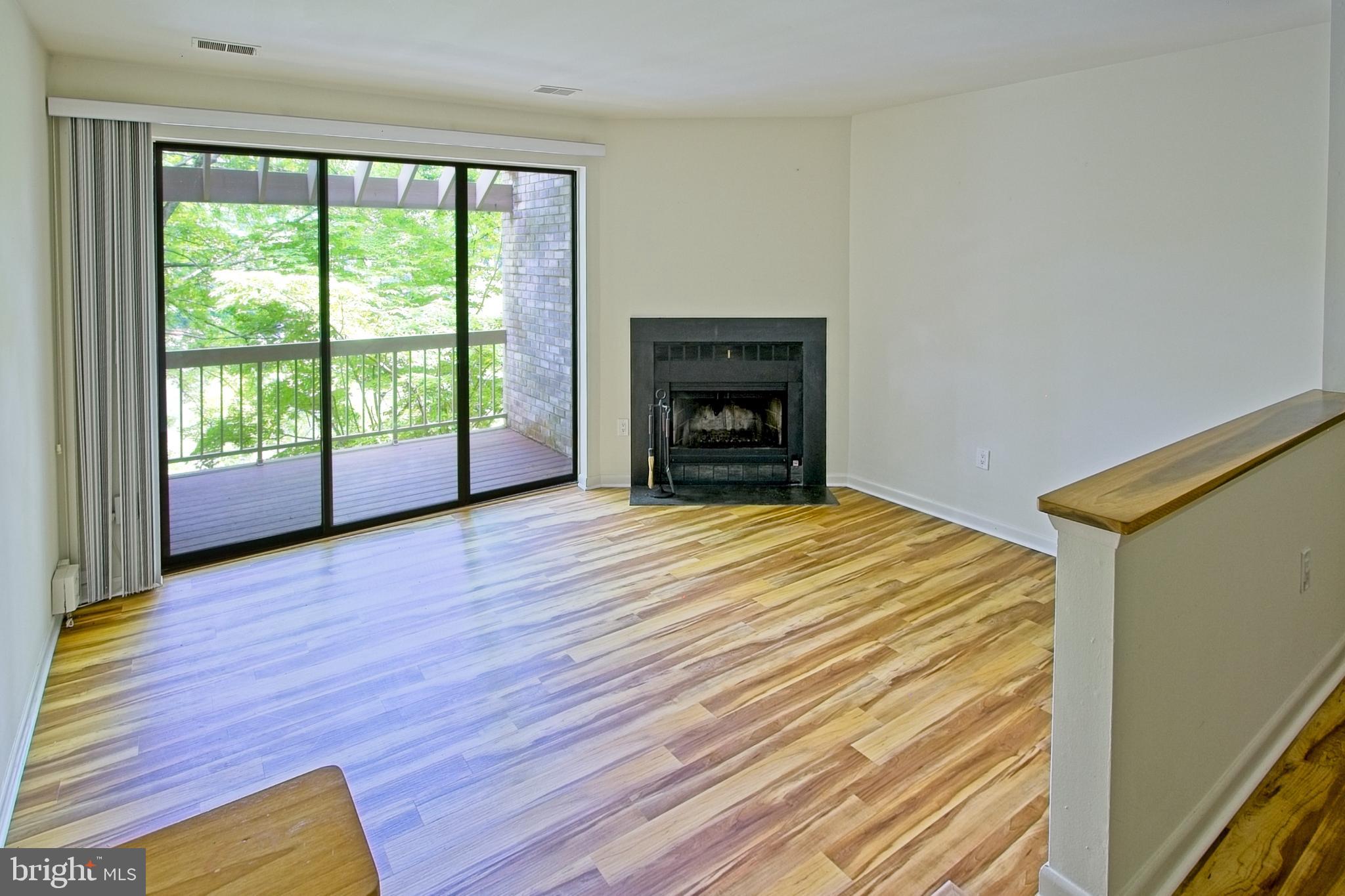 11108 Boathouse Court, Unit 97 Reston, VA 20191 - Photo 2 of 28 Living room with deck access