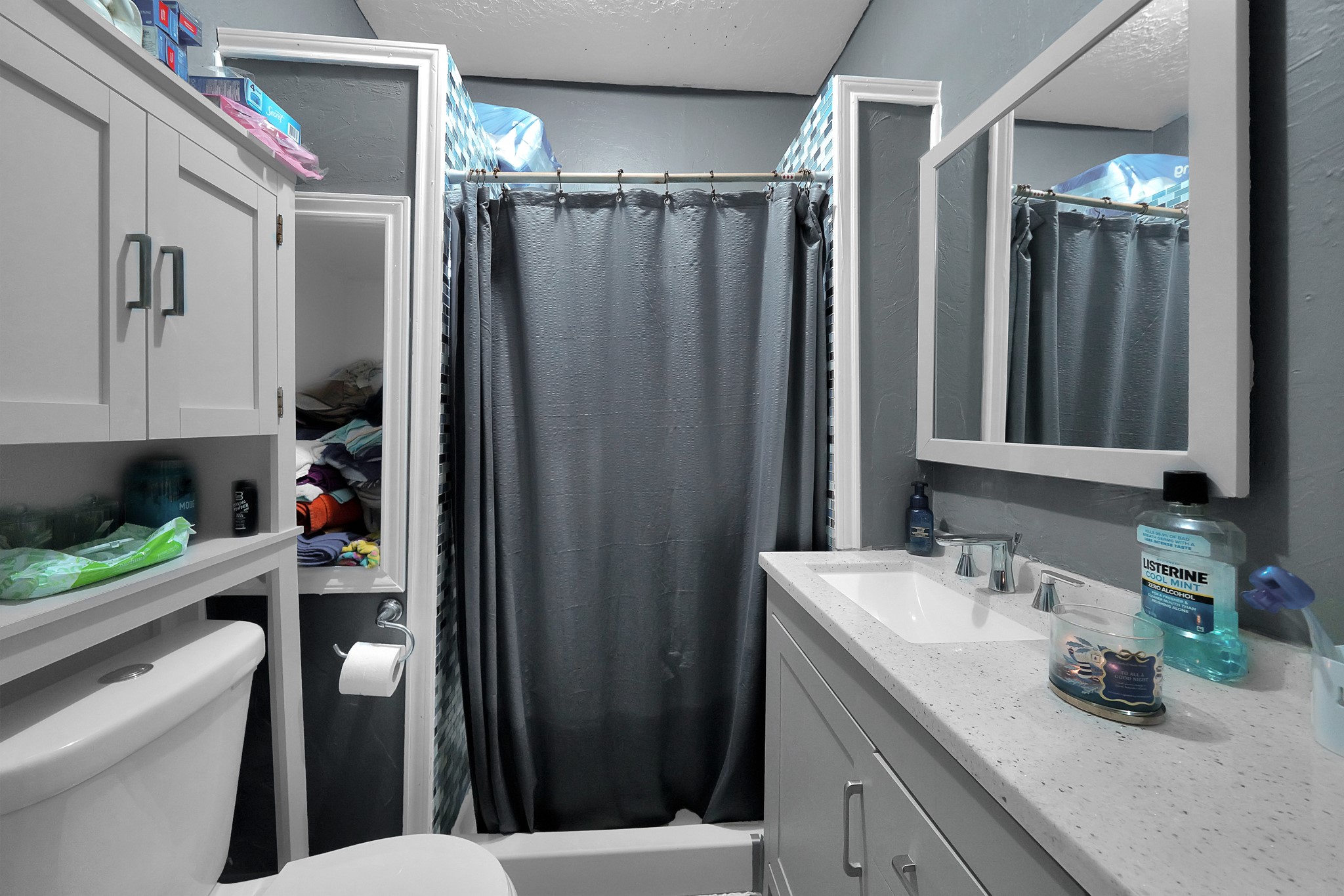 1414 Moody Street Houston, TX 77009 - Photo 11 of 27 a bathroom with a sink a toilet and shower curtain