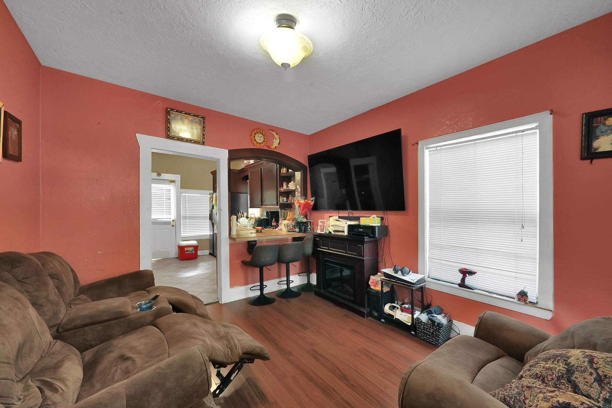 1414 Moody Street Houston, TX 77009 - Photo 20 of 27 a living room with furniture a flat screen tv and a window