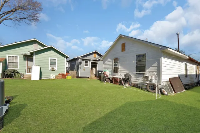 an aerial view of residential houses with outdoor space