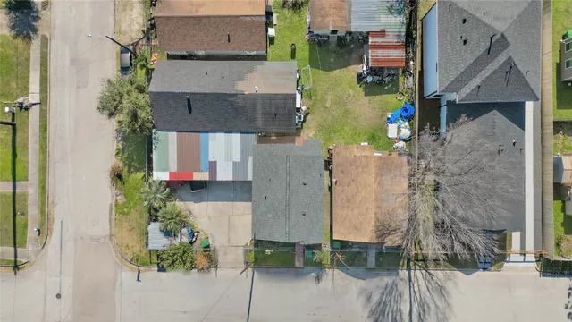 an aerial view of residential houses with outdoor space