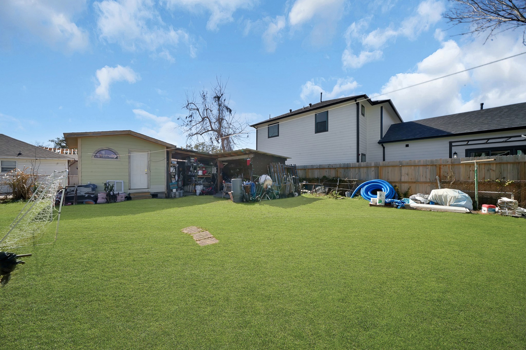 1414 Moody Street Houston, TX 77009 - Photo 8 of 27 a front view of a house with garden