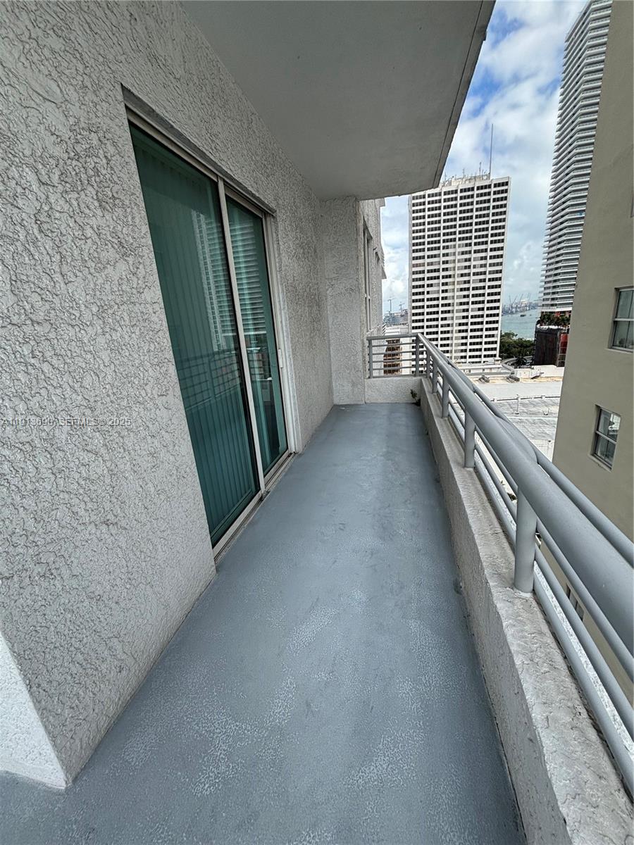 133 Northeast 2nd Avenue, Unit 1519 Miami, FL 33132 - Photo 12 of 41 a view of a hallway to the kitchen