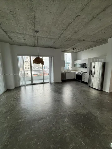 a view of an empty room with a fireplace