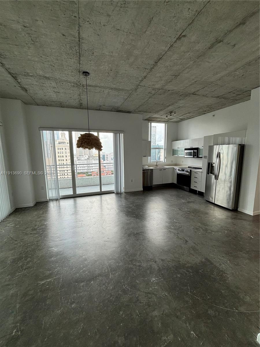 133 Northeast 2nd Avenue, Unit 1519 Miami, FL 33132 - Photo 2 of 41 a view of an empty room with a fireplace