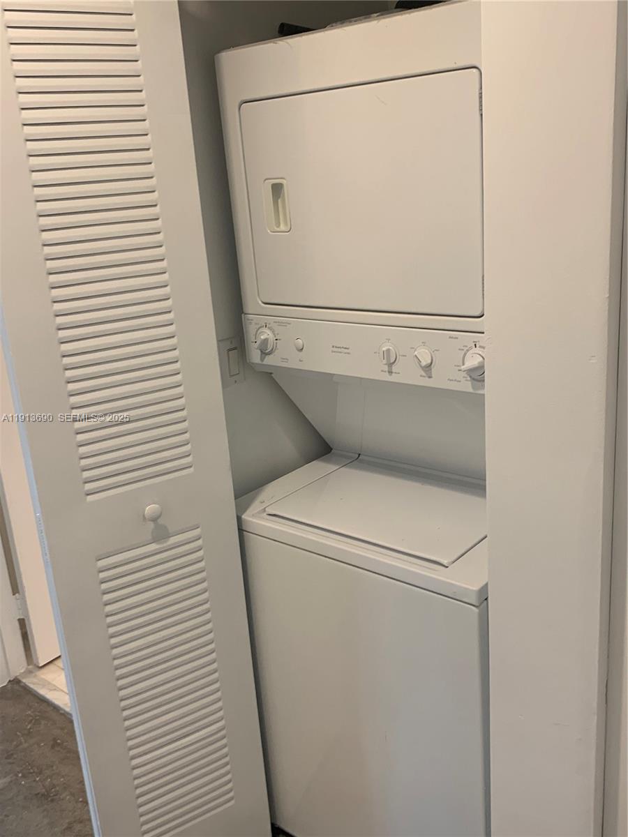 133 Northeast 2nd Avenue, Unit 1519 Miami, FL 33132 - Photo 21 of 41 a utility room with dryer and washer