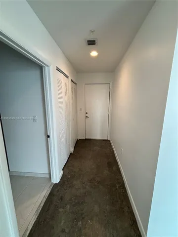 a room with lots of bottles of alcohol