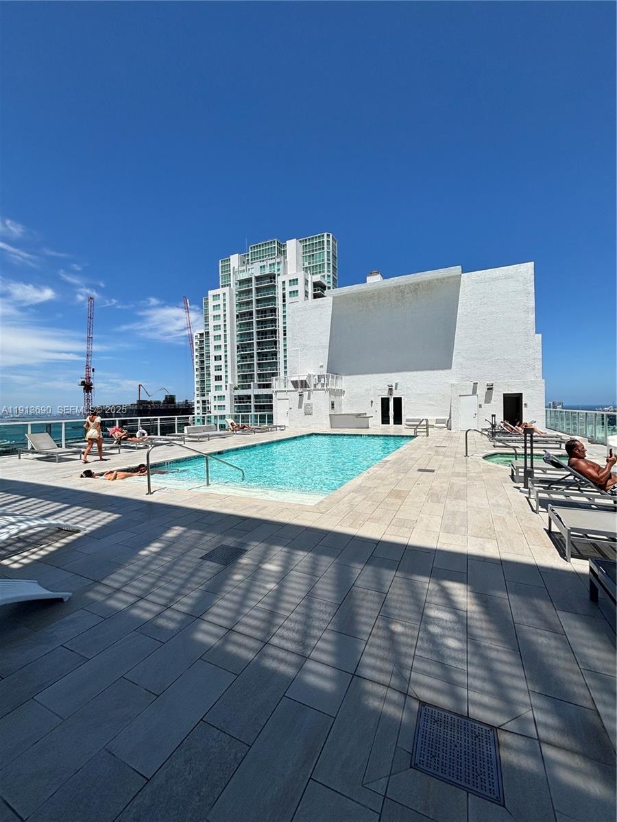 133 Northeast 2nd Avenue, Unit 1519 Miami, FL 33132 - Photo 27 of 41 a view of pool with outdoor space and seating area