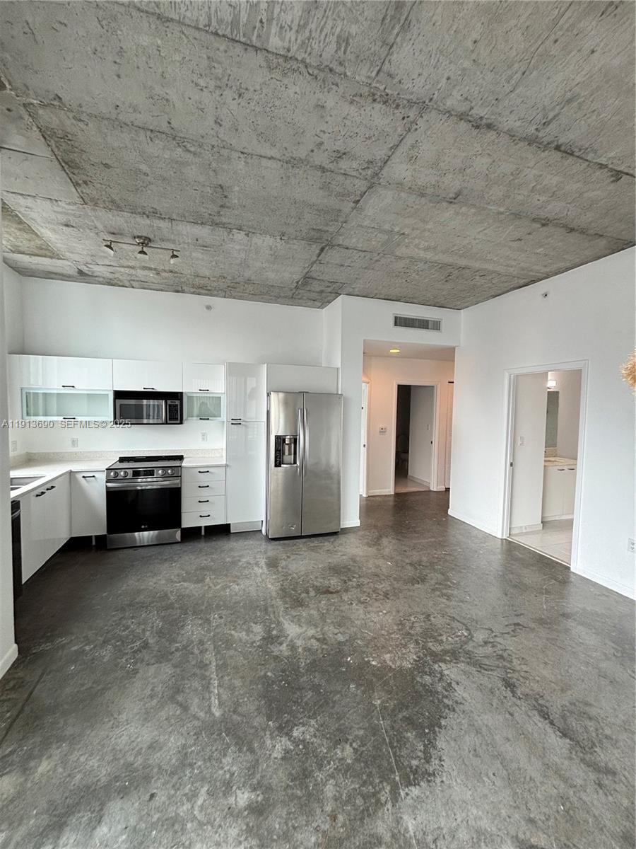 133 Northeast 2nd Avenue, Unit 1519 Miami, FL 33132 - Photo 3 of 41 a view of a livingroom with a kitchen