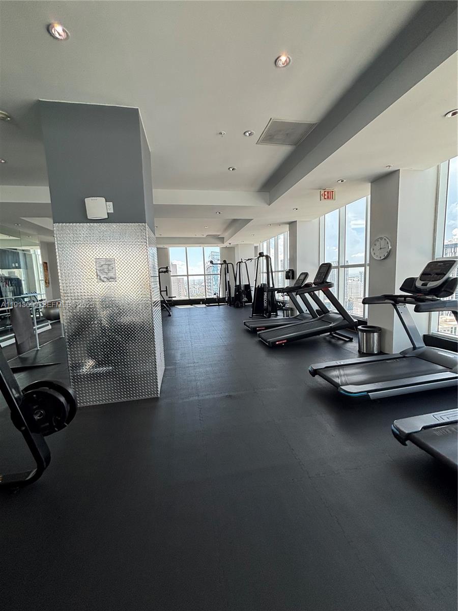 133 Northeast 2nd Avenue, Unit 1519 Miami, FL 33132 - Photo 33 of 41 a view of a room with gym equipment
