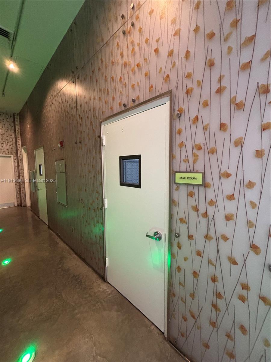 133 Northeast 2nd Avenue, Unit 1519 Miami, FL 33132 - Photo 36 of 41 a bathroom with a shower and a mirror